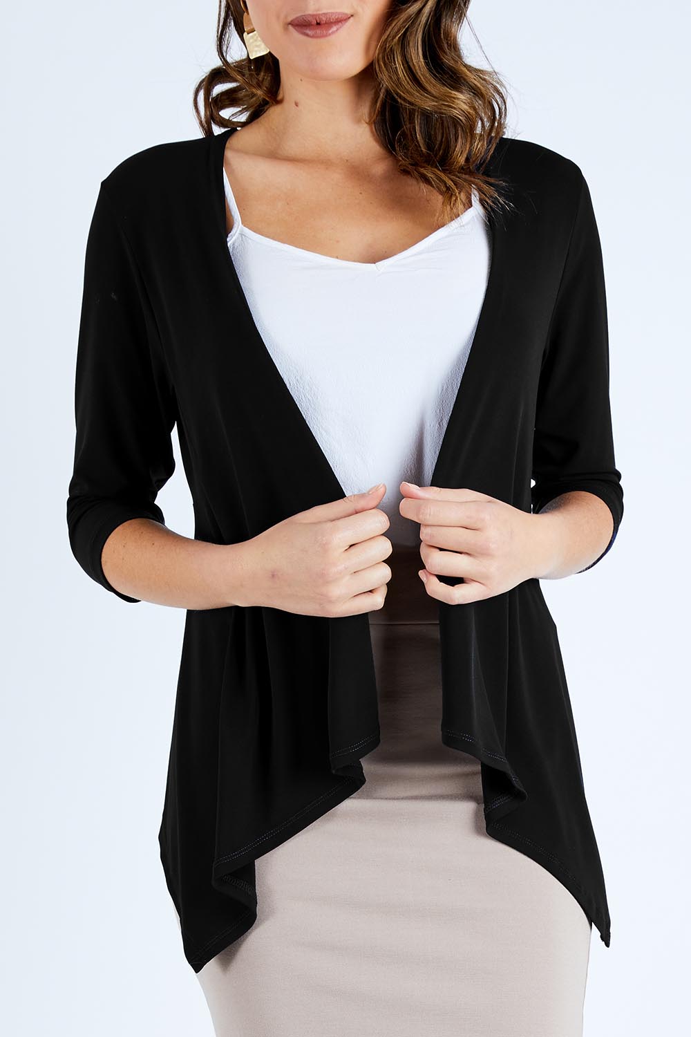 Model Madeline wearing size 10 of The Drape Cardi in colour Black (Black), from the front, cropped image