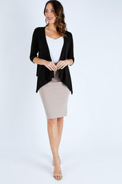 Model Madeline wearing size 10 of The Drape Cardi in colour Black (Black), from the front, showing the whole outfit
