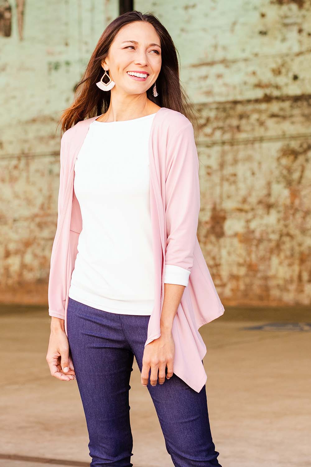 Model Cara wearing size 10 of The Drape Cardi in colour Blushpink (Pink), from the front, showing the whole outfit