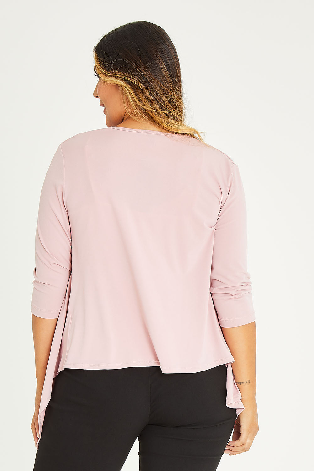 Model Palatina wearing size 16 of The Drape Cardi in colour Blushpink (Pink), from the back