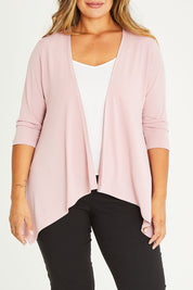Model Palatina wearing size 16 of The Drape Cardi in colour Blushpink (Pink), from the front, cropped image
