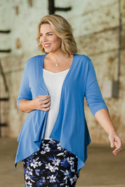 Model Fiona wearing size 16 of The Drape Cardi in colour Denimblue (Blue), from the front, showing the whole outfit