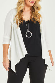 Model Katie wearing size 16 of The Drape Cardi in colour Ivory (White), from the front, cropped image