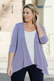 Model Fiona wearing size 16 of The Drape Cardi in colour Lilac (Purple), from the front, showing the whole outfit