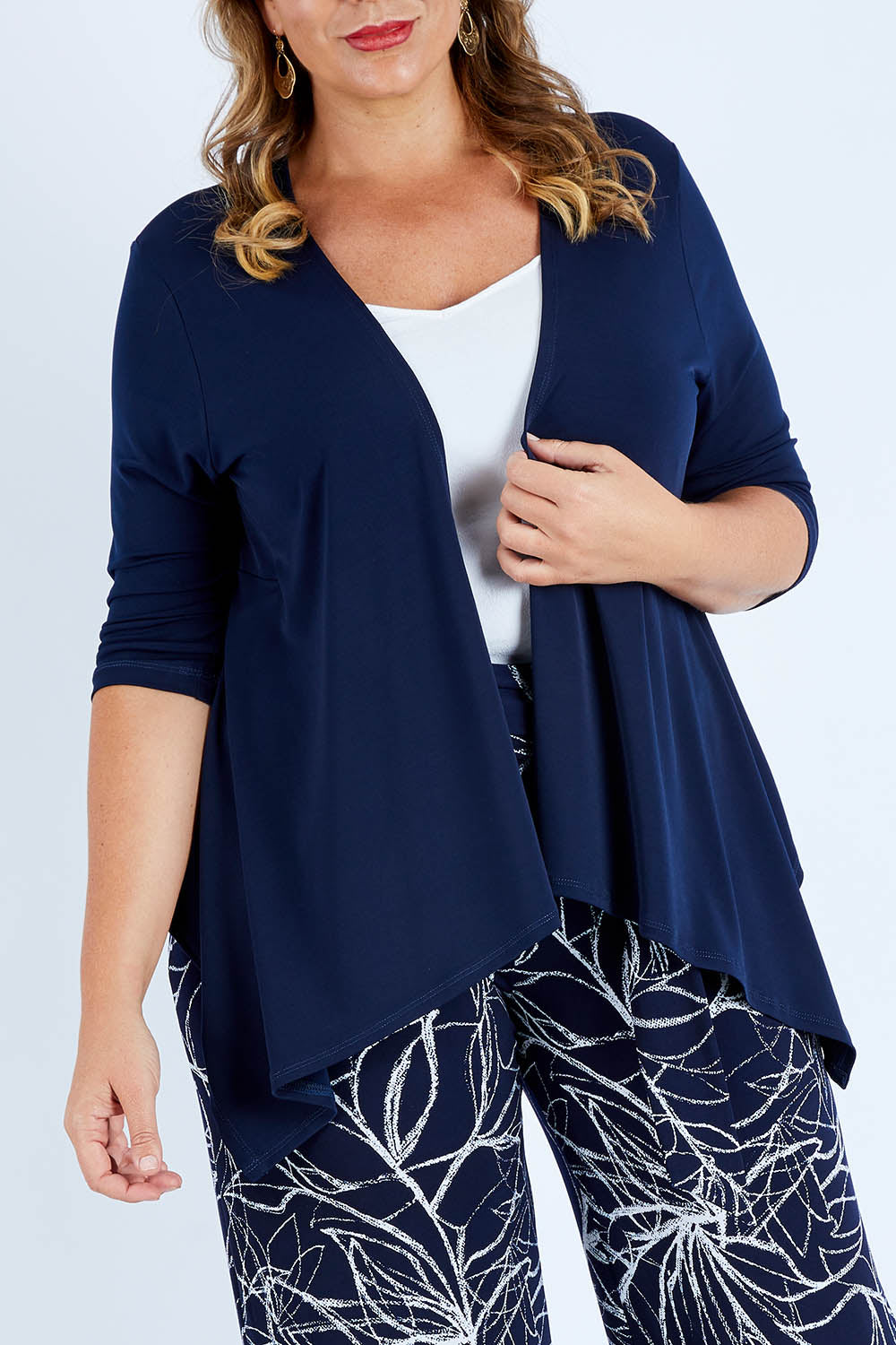 Model Fiona wearing size 16 of The Drape Cardi in colour Navy (Blue), from the front, cropped image