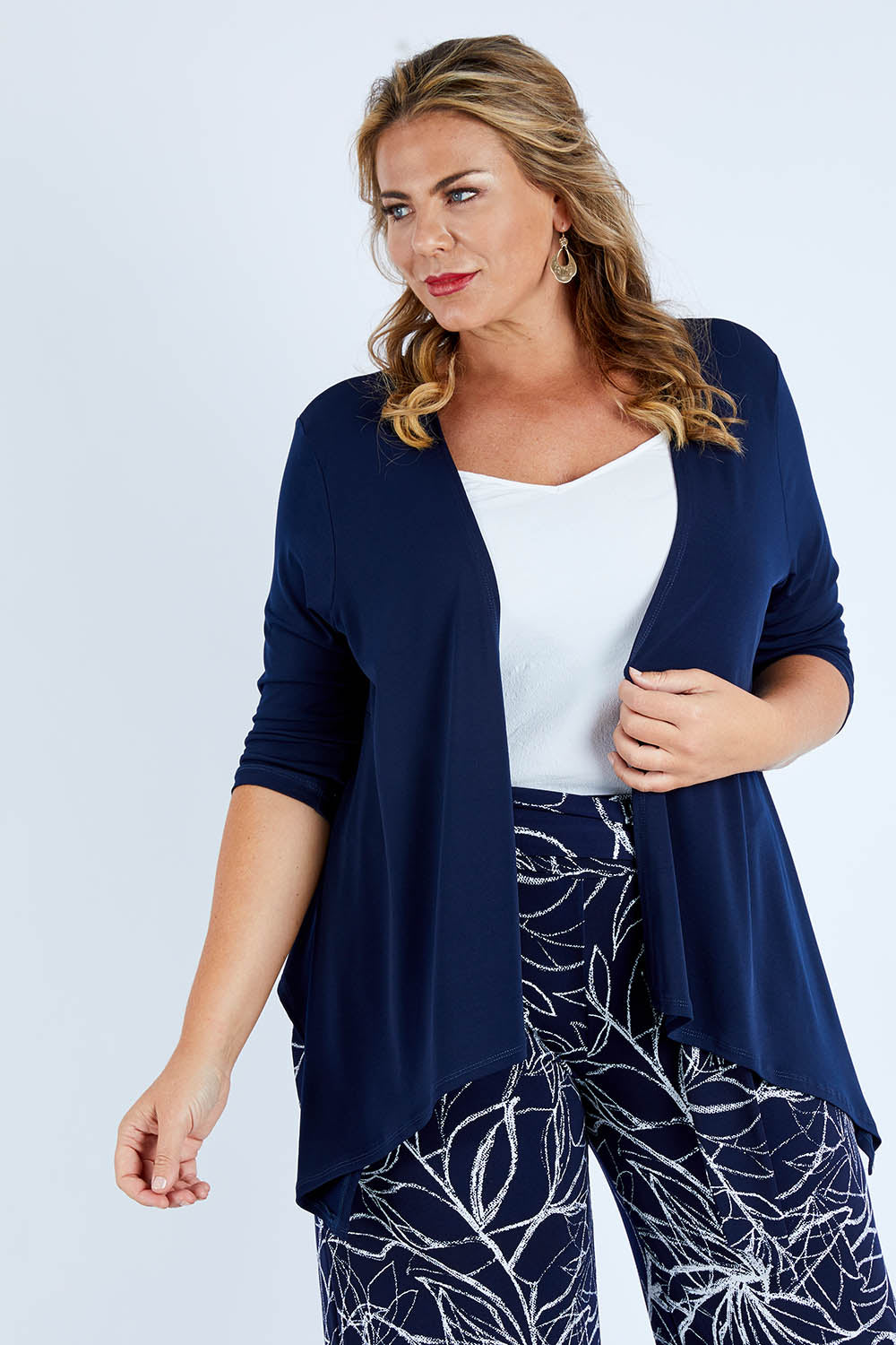Model Fiona wearing size 16 of The Drape Cardi in colour Navy (Blue), from the front, cropped image