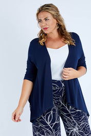 Model Fiona wearing size 16 of The Drape Cardi in colour Navy (Blue), from the front, cropped image