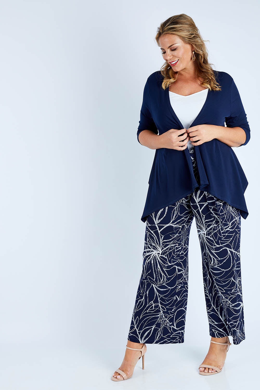 Model Fiona wearing size 16 of The Drape Cardi in colour Navy (Blue), from the front, showing the whole outfit