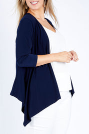 Model Jess wearing size 14 of The Drape Cardi in colour Navy (Blue), from the front, cropped image