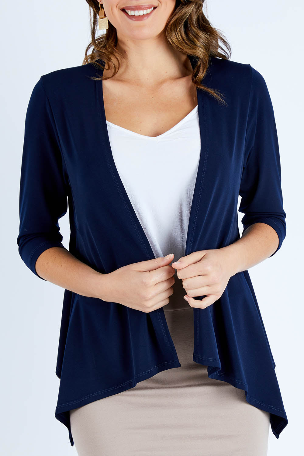 Model Madeline wearing size 10 of The Drape Cardi in colour Navy (Blue), from the front, cropped image