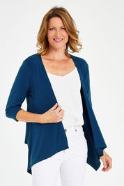 Model Naomi wearing size 10 of The Drape Cardi in colour Ocean (Blue), from the front, cropped image