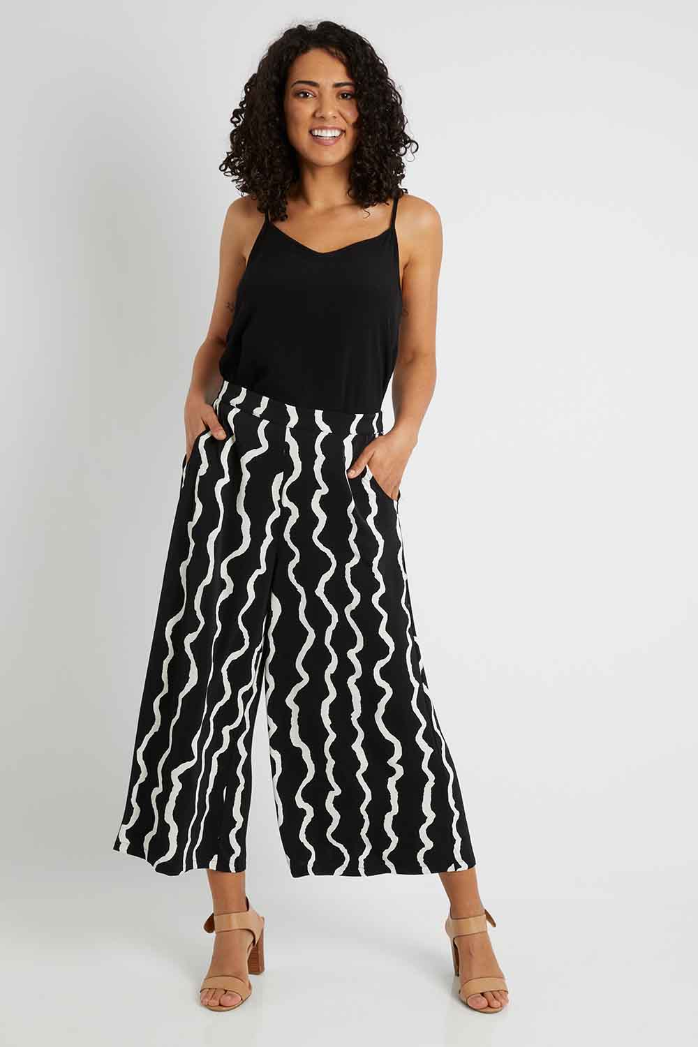 Model Pamela wearing size 10 of The Luxe Printed Pull On Culottes in colour Squiggle (Black), from the front, showing the whole outfit
