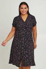 Model Ashleigh wearing size 16 of The Printed Cotton V Neck Dress in colour Ditsy (Black), from the front, cropped image