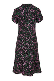 Product shot of The Printed Cotton V Neck Dress in colour Ditsy (Black), from the back