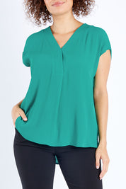 Model Lala wearing size 10 of The Essential Top in colour Jade (Green), from the front, cropped image