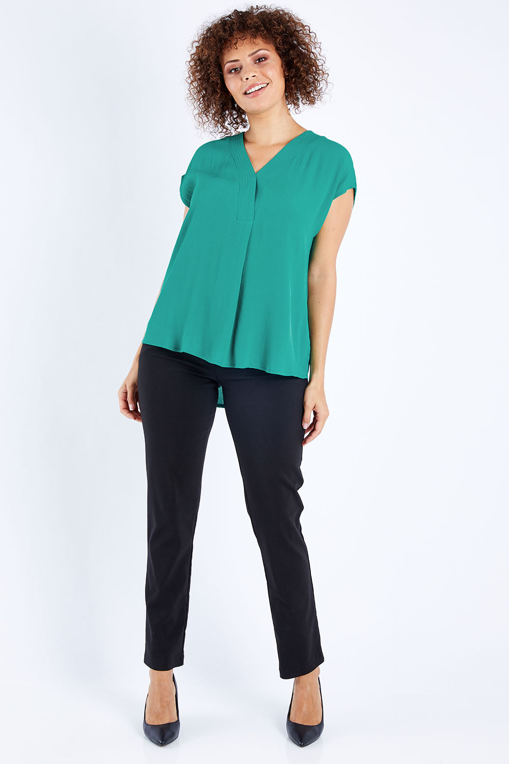Model Lala wearing size 10 of The Essential Top in colour Jade (Green), from the front, showing the whole outfit