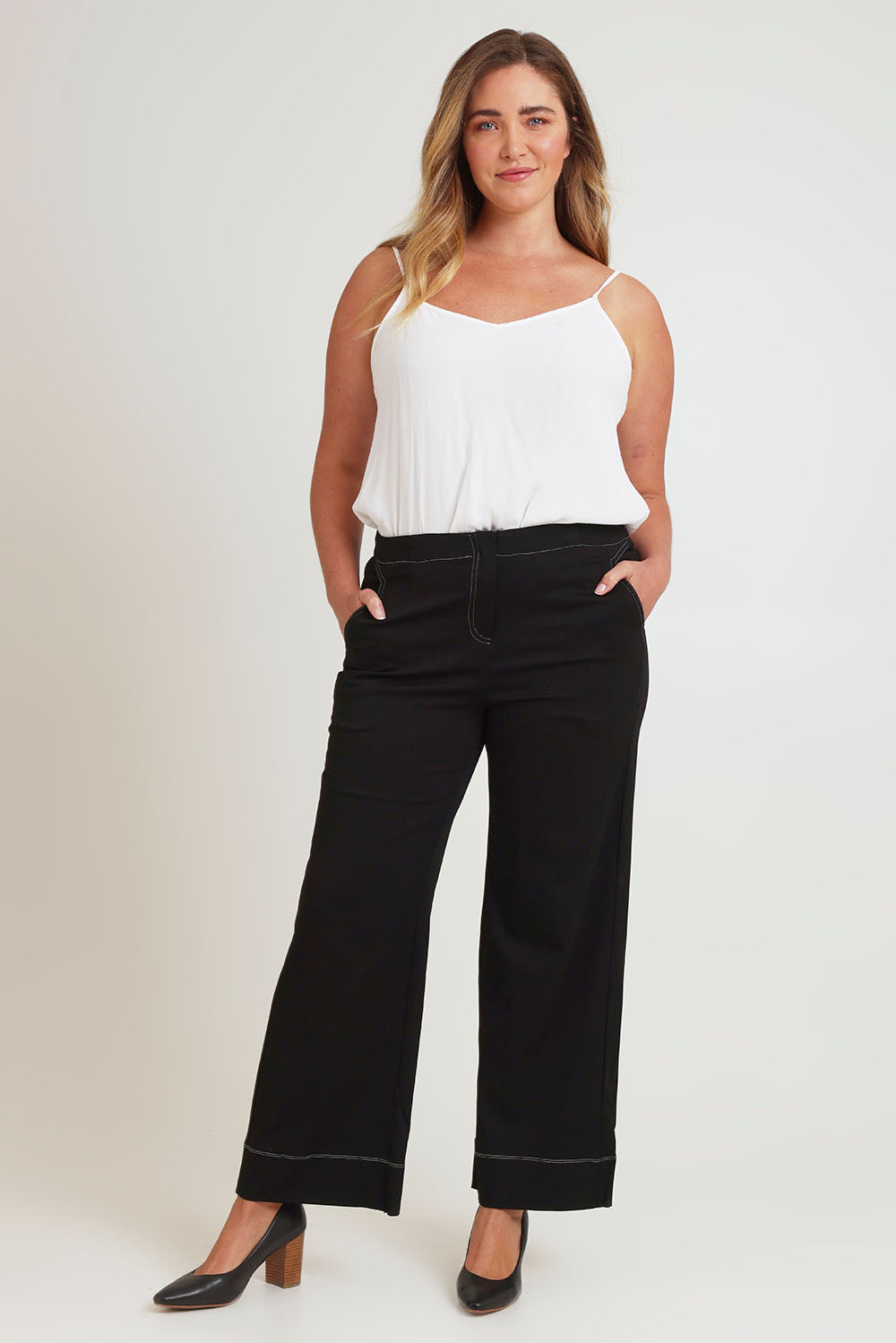 Model Chanel wearing size 16 of The Contrast Stitching Stretch Pant in colour Black (Black), from the front, showing the whole outfit