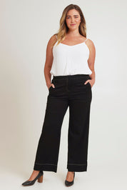 Model Chanel wearing size 16 of The Contrast Stitching Stretch Pant in colour Black (Black), from the front, showing the whole outfit