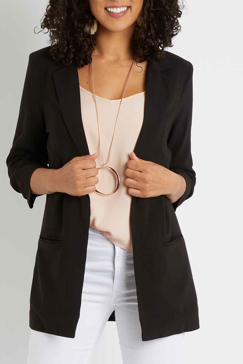Model Pamela wearing size 10 of The Soft Fall Ruched Sleeve Blazer in colour Black (Black), from the front, cropped image