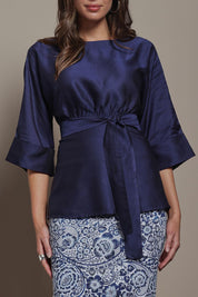 Model Madeline wearing size 10 of The Luxe Dolman Sleeve Blouse in colour Darkcobalt (Blue), from the front, cropped image