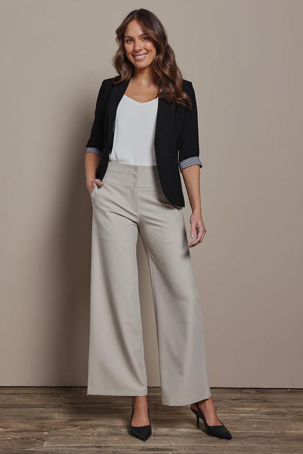 Model Madeline wearing size 10 of The Contrast Inner Cuff Blazer in colour Black (Black), from the front, showing the whole outfit