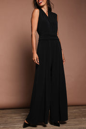 Model Amanda wearing size 10 of The Sleeveless Wide Leg Jumpsuit in colour Black (Black), from the front, cropped image