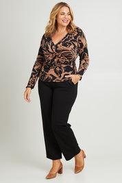 Model Fiona wearing size 16 of The Printed Side Ring Detail Blouse in colour Tanfleur (Black), from the front, showing the whole outfit