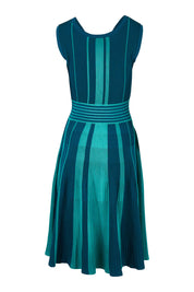 Product shot of The Reversible Knit Dress in colour Peacock (Blue), from the back