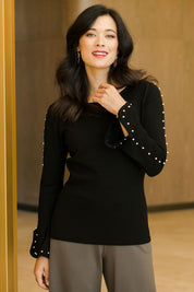 Model Miranda wearing size S of The Pearl Detail Knit in colour Black (Black), from the front, showing the whole outfit