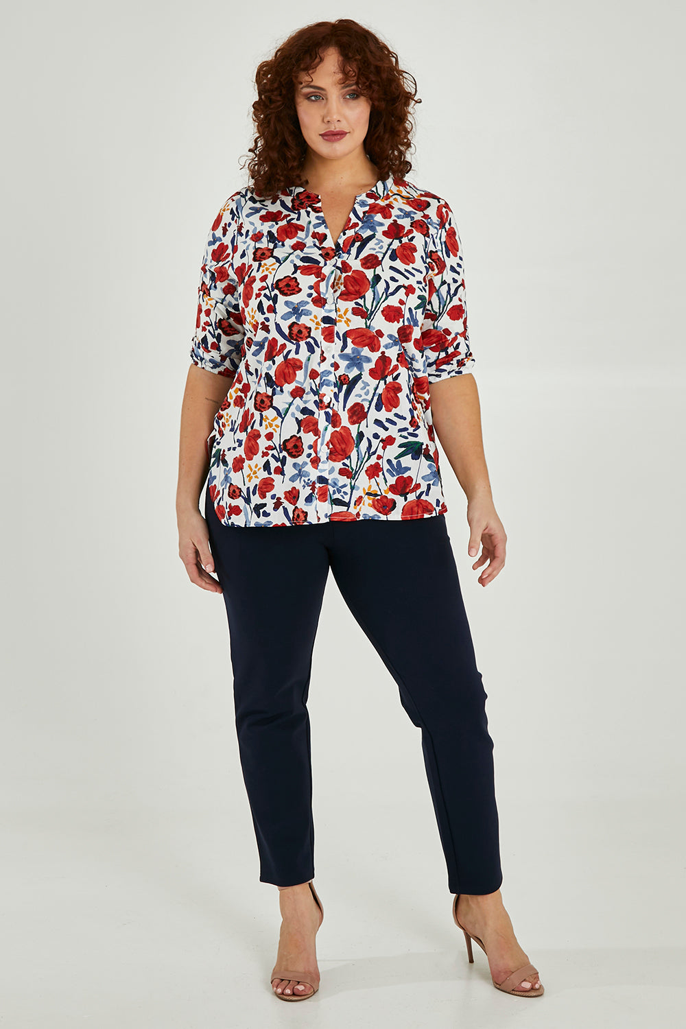 Model Maddy wearing size 16 of The High Rise Pull On Ponte Pant in colour Navy (Blue), from the front, showing the whole outfit