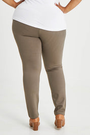 Model Alexis wearing size 16 of The High Rise Pull On Ponte Pant in colour Taupe, from the back