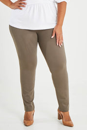 Model Alexis wearing size 16 of The High Rise Pull On Ponte Pant in colour Taupe, from the front, cropped image
