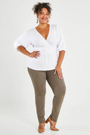 Model Alexis wearing size 16 of The High Rise Pull On Ponte Pant in colour Taupe, from the front, showing the whole outfit