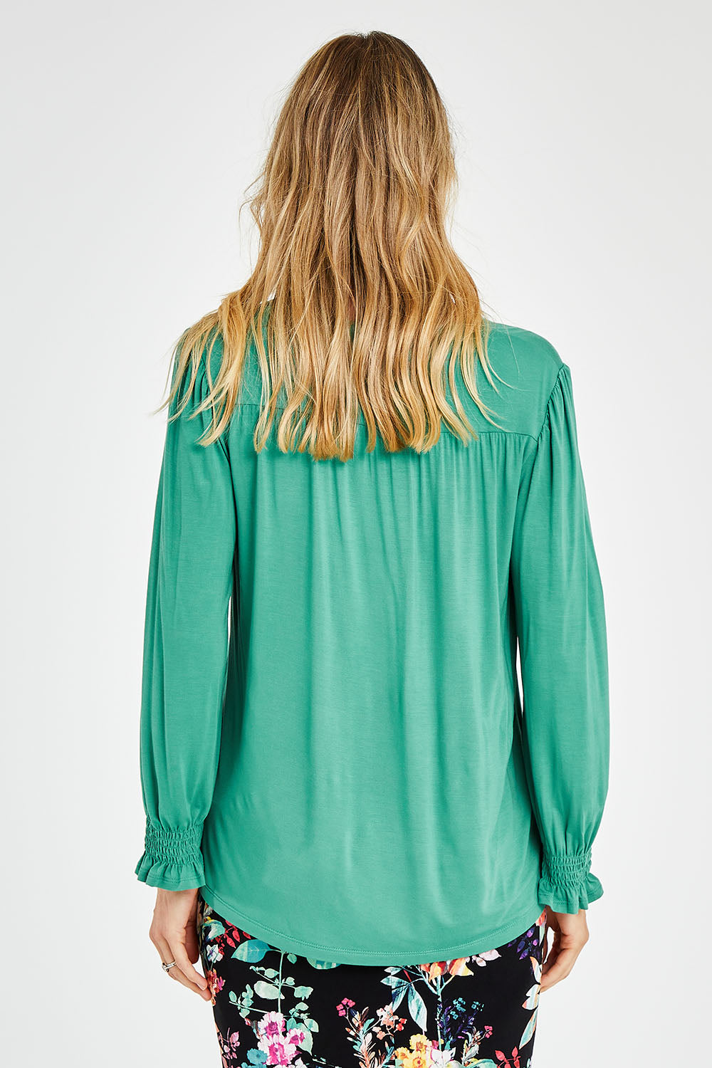 Model Kelly wearing size 10 of The Modal Top in colour Jade (Green), from the back