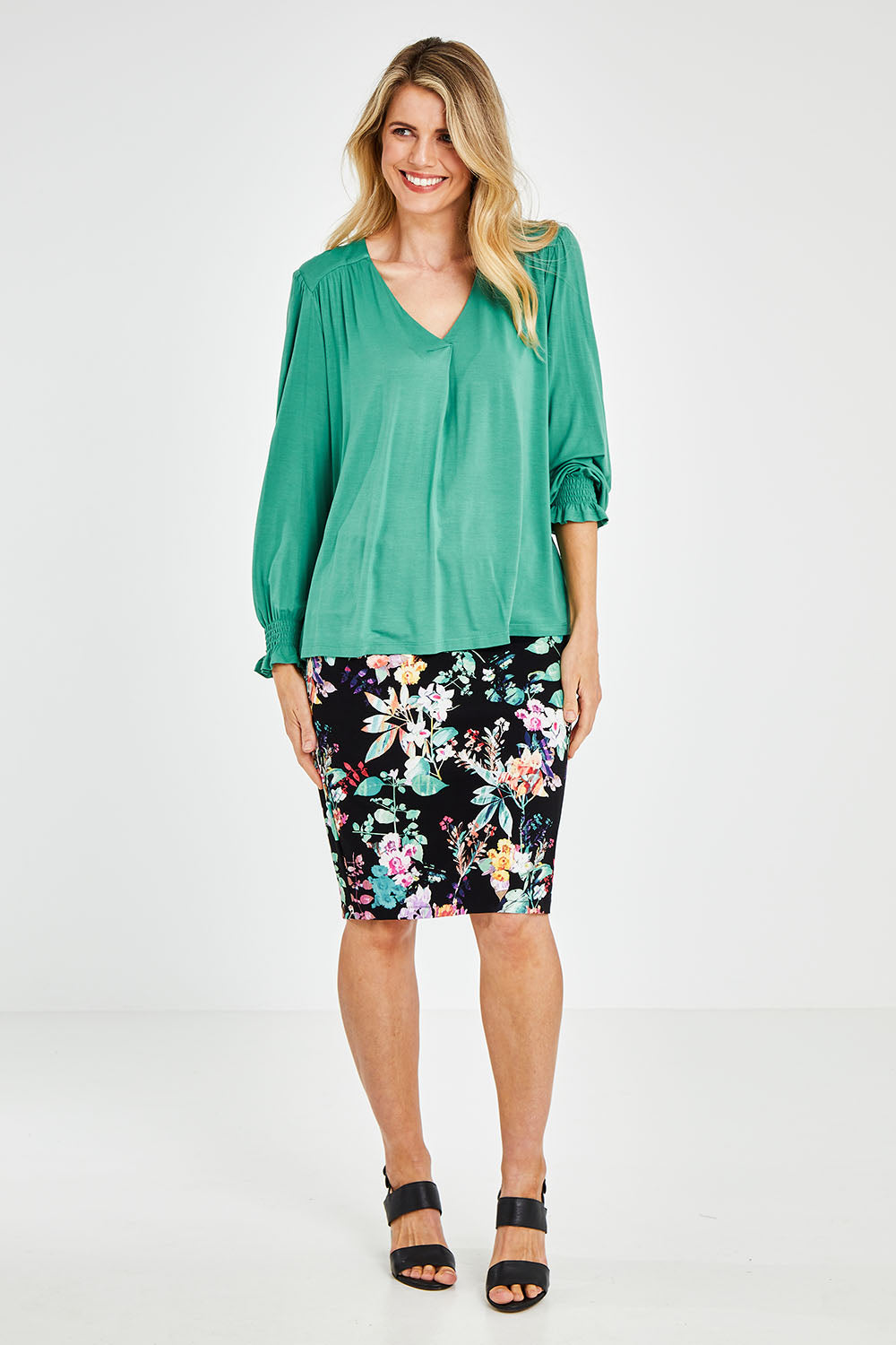 Model Kelly wearing size 10 of The Modal Top in colour Jade (Green), from the front, showing the whole outfit