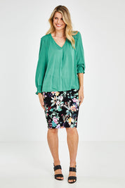 Model Kelly wearing size 10 of The Modal Top in colour Jade (Green), from the front, showing the whole outfit
