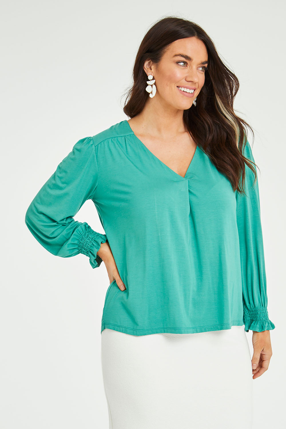 Model Laura wearing size 14 of The Modal Top in colour Jade (Green), from the front, cropped image