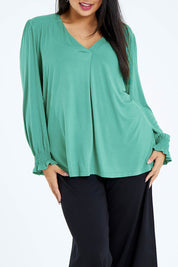 Model Sasha-Lee wearing size 16 of The Modal Top in colour Jade (Green), from the front, cropped image