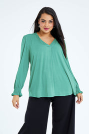 Model Sasha-Lee wearing size 16 of The Modal Top in colour Jade (Green), from the front, cropped image