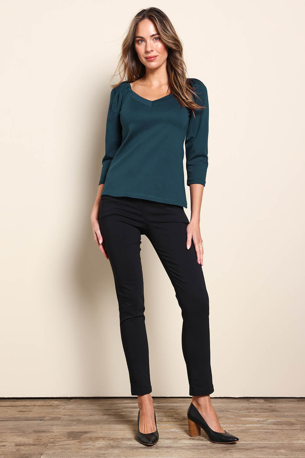 Model Madelinec wearing size 10 of the The Define Ponte Top – Lagoon in colour Lagoon, from the front