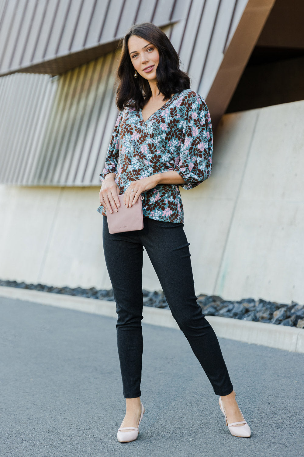 Model Andrea wearing size 10 of The Stretch Tapered Pull On Pant in colour Black (Black), from the front, showing the whole outfit