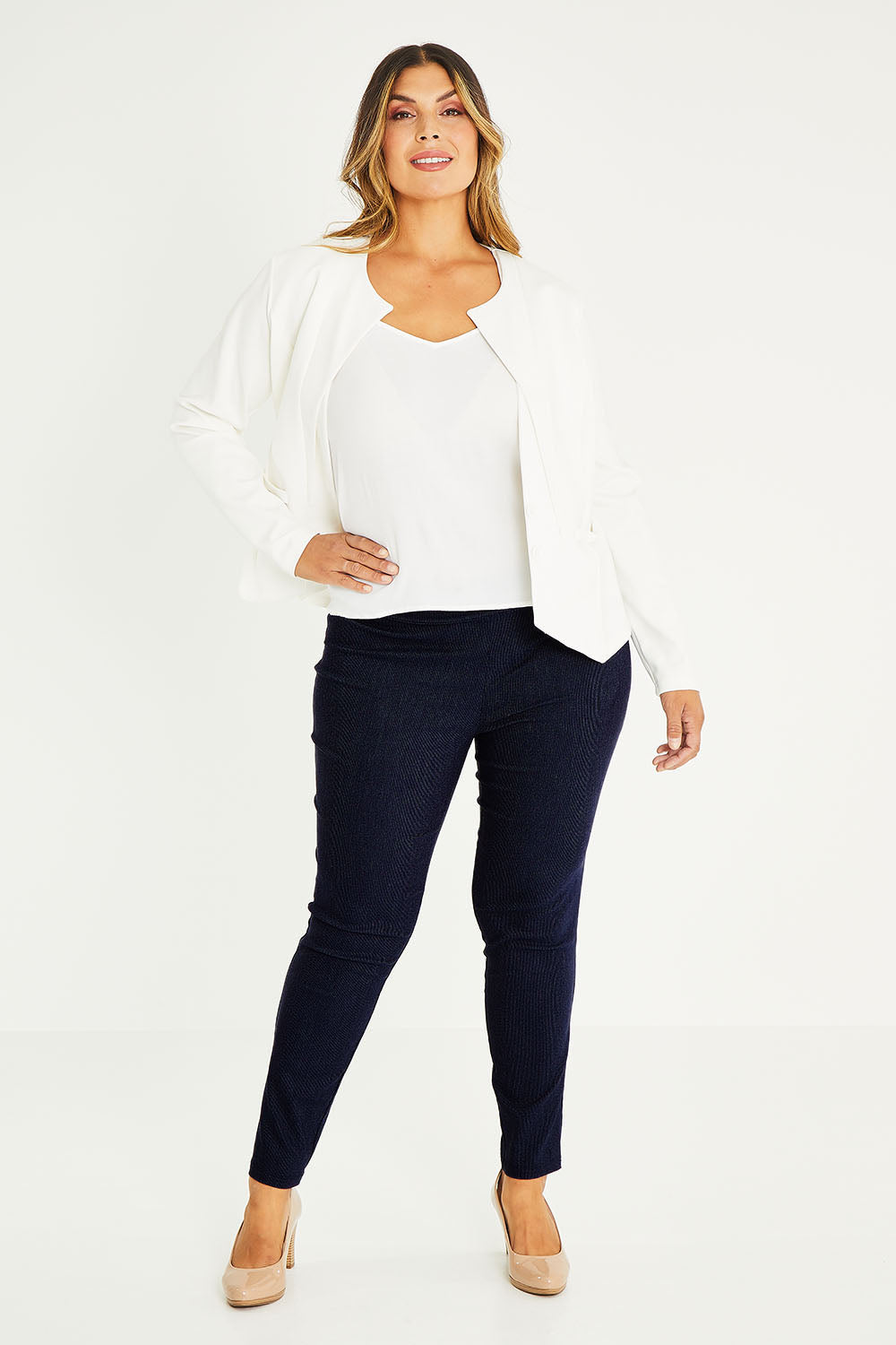 Model Palatina wearing size 14 of The Stretch Tapered Pull On Pant in colour Navy (Blue), from the front, showing the whole outfit