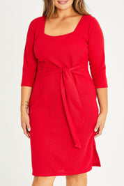 Model Palatina wearing size 16 of The Square Neck Tapered Dress in colour Red (Red), from the front, cropped image