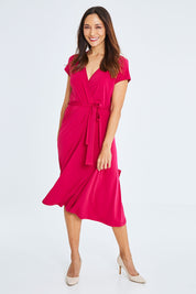 Model Cara wearing size 10 of The Fit And Flare Jersey Dress in colour Cerise (Pink), from the front, showing the whole outfit