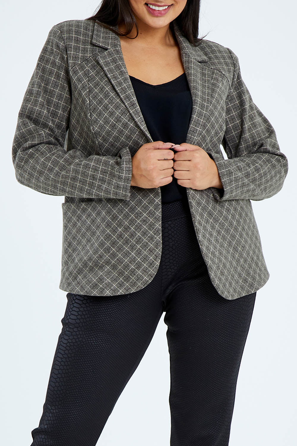 Model Sasha-Lee wearing size 16 of The Check Pocket Blazer in colour Checks (Grey), from the front, cropped image