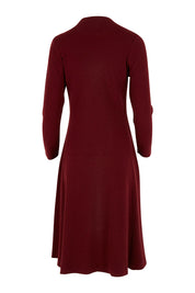 Product shot of The Fit And Flare Knitted Rib Dress in colour Burgundy (Red), from the back