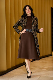 Model Miranda wearing size S of The Fit And Flare Knitted Rib Dress in colour Chocolate, from the front, showing the whole outfit