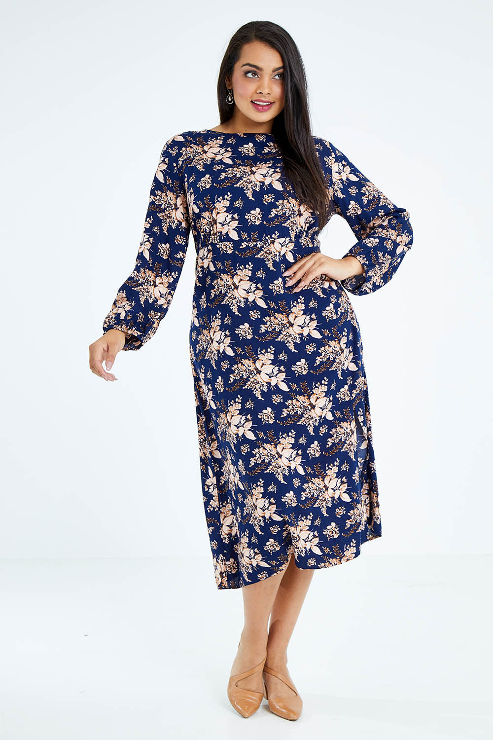 Model Sasha-Lee wearing size 16 of The Printed Rayon Dress in colour Floral (Blue), from the front, showing the whole outfit