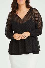 Model Laura wearing size 14 of The Smocked Cuff Lace Blouse in colour Black (Black), from the front, cropped image