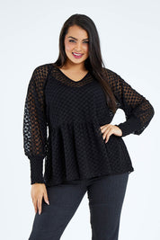 Model Sasha-Lee wearing size 16 of The Smocked Cuff Lace Blouse in colour Black (Black), from the front, cropped image